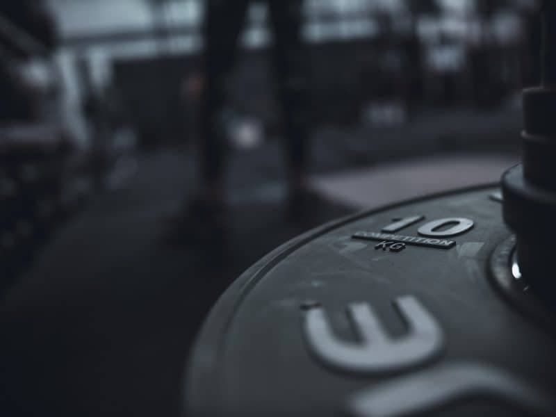 Athletes pushing through a Hyrox-style workout